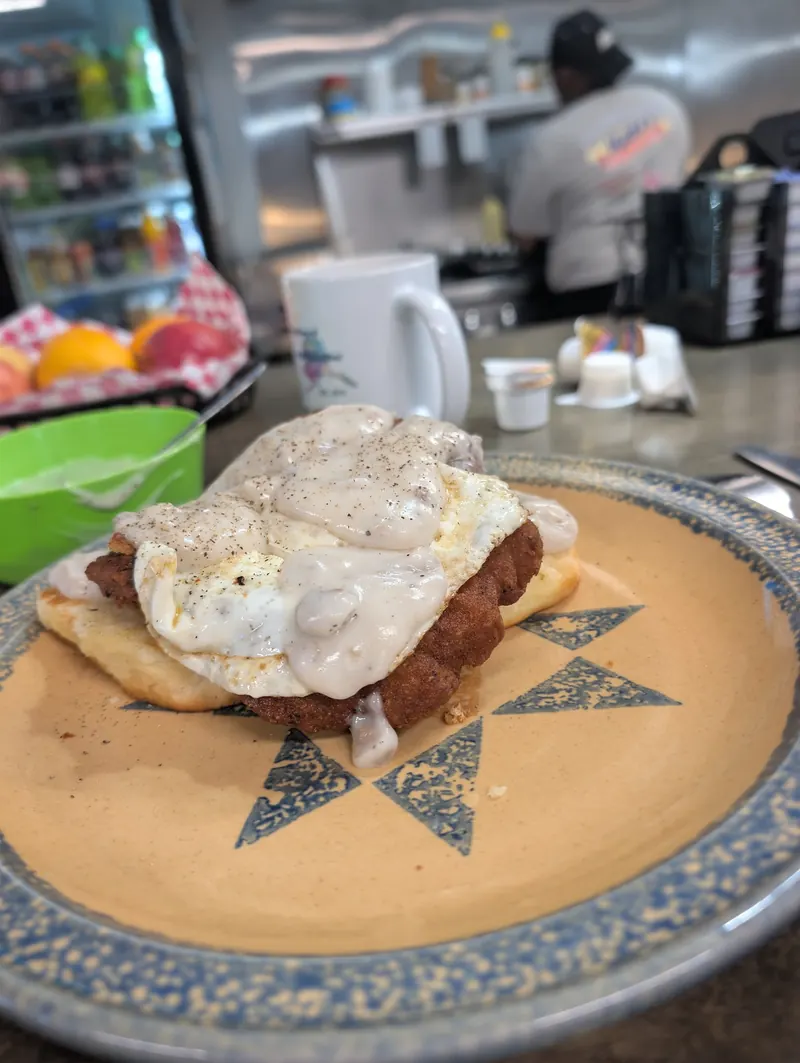 Smothered biscuit with a fried egg